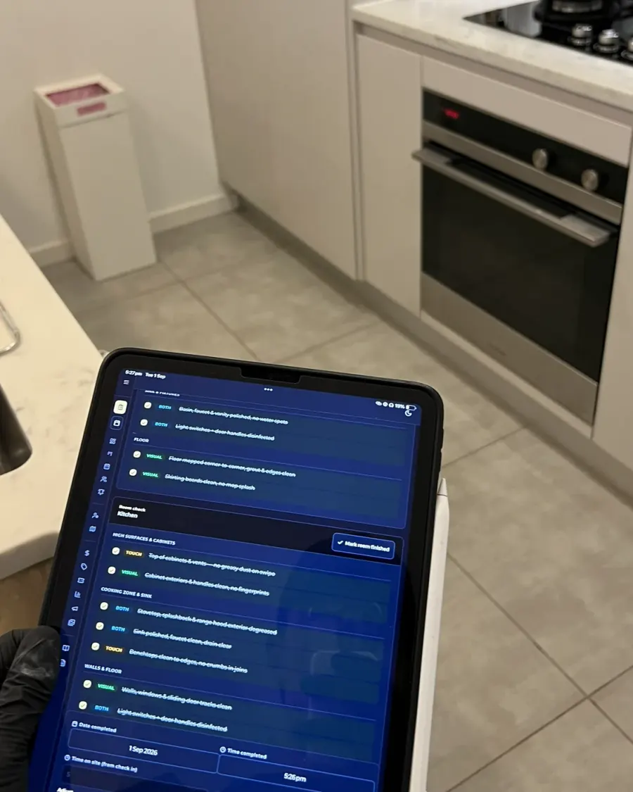 The written checklist open on a tablet in a client's kitchen